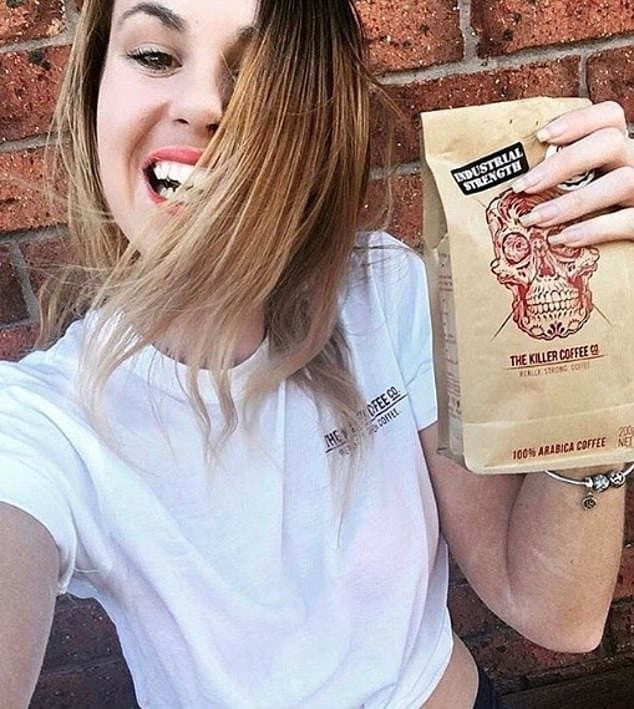 Customer holding a bag of Killer Coffee